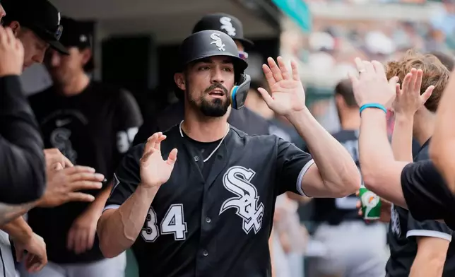 Chicago White Sox's Randal Grichuk (34) celebrates scoring against the Detroit Tigers during the seventh inning of a baseball game Saturday, Aug. 15, 2026, in Detroit. (AP Photo/Paul Sancya)