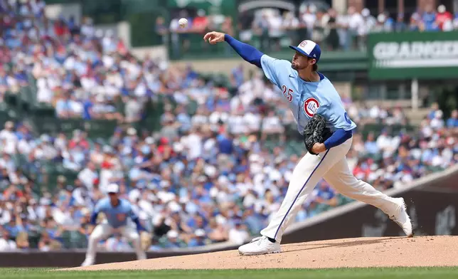 Chicago Cubs pitcher Clay Holmes delivers to a St. Louis Cardinals batter during the first inning of a baseball game in Chicago, Friday, Aug. 14, 2026. (AP Photo/Jessie Alcheh)