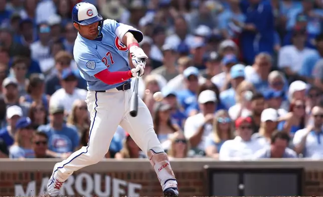Chicago Cubs designated hitter Seiya Suzuki hits a home run during the sixth inning of a baseball game against the St. Louis Cardinals in Chicago, Friday, Aug. 14, 2026. (AP Photo/Jessie Alcheh)
