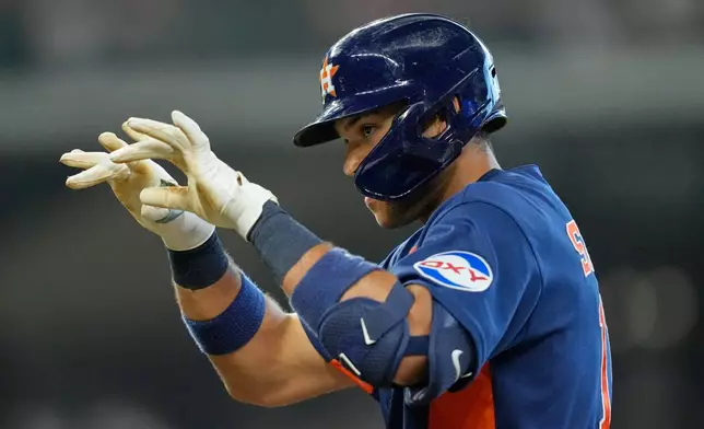 Houston Astros' Cam Smith celebrates after hitting a two-run single against the Texas Rangers during the seventh inning of a baseball game Sunday, Aug. 2, 2026, in Houston. (AP Photo/David J. Phillip)