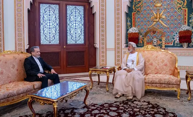 FILE - In this photo released by the Iranian Foreign Ministry, Iranian Foreign Minister Abbas Araghchi, left, meets with Oman's Sultan Haitham bin Tariq in Muscat, Oman, April 26, 2026. (Iranian Foreign Ministry via AP, File)