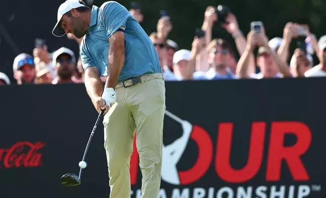 Scottie Scheffler hits from 18th tee during the final round of the PGA Tour Championship golf tournament Sunday, Aug. 30, 2026, in Atlanta. (AP Photo/Colin Hubbard)