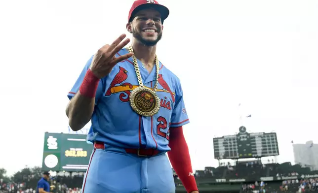 St. Louis Cardinals' Joshua Baez poses after setting an MLB record with three home runs during his MLB debut after defeating the Chicago Cubs in a baseball game in Chicago, Saturday, Aug. 15, 2026. (AP Photo/Paul Beaty)