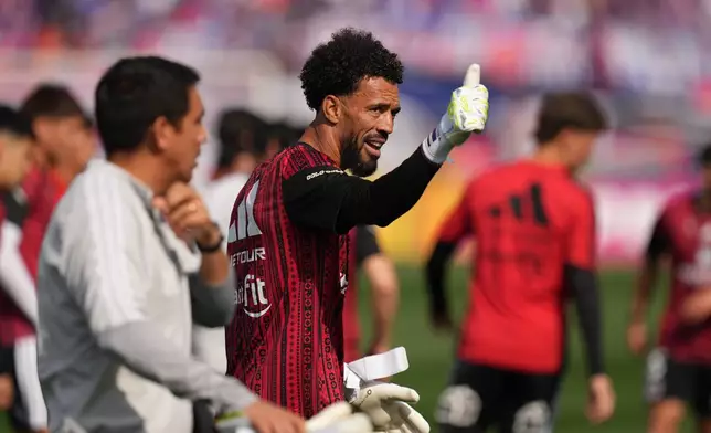Colo Colo goalkeeper Vozinha, from Cape Verde, enters the field prior to a Chilean soccer league match between Colo Colo and Universidad de Chile in Santiago, Chile, Sunday, Aug. 23, 2026. (AP Photo/Esteban Felix)