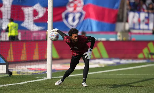 Colo Colo goalkeeper Vozinha, from Cape Verde, warms up for a Chilean soccer league match between Colo Colo and Universidad de Chile in Santiago, Chile, Sunday, Aug. 23, 2026. (AP Photo/Esteban Felix)