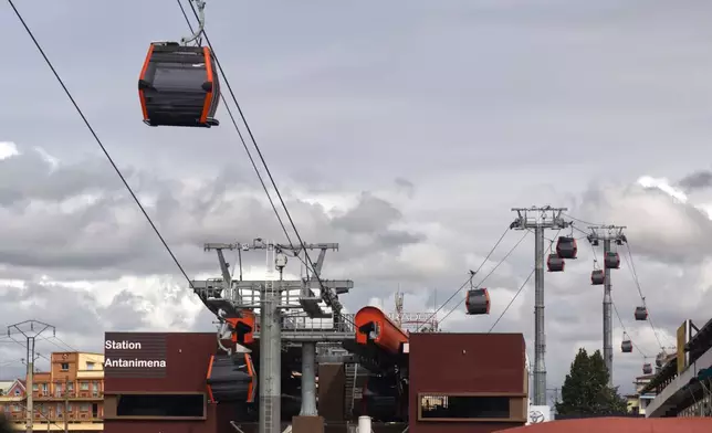 Cable cars operate during testing in Antananarivo, Madagascar, Friday, June 27, 2025. (AP Photo/Alexander Joe)