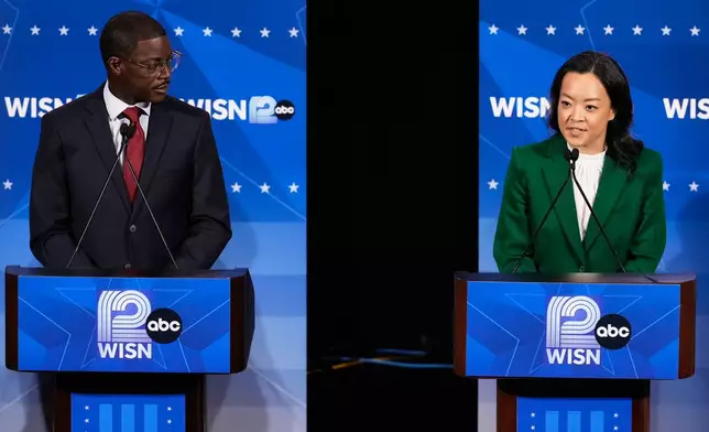 Democratic gubernatorial candidate Francesca Hong, right, talks as David Crowley listens during a primary debate in Milwaukee, Tuesday, July 28, 2026. (AP Photo/Nam Y. Huh)