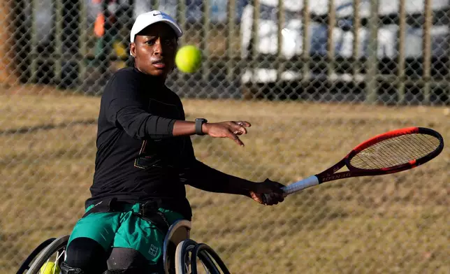 Kgothatso Montjane, a South African Paralympic wheelchair tennis champion, plays a return shot during practice in Pretoria, South Africa, Saturday, Aug. 1, 2026. (AP Photo/Themba Hadebe)