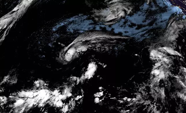 This satellite image released by NOAA shows Tropical Storm Lala over the Pacific Ocean, near Hawaii, Saturday, Aug. 15, 2026. (NOAA via AP)