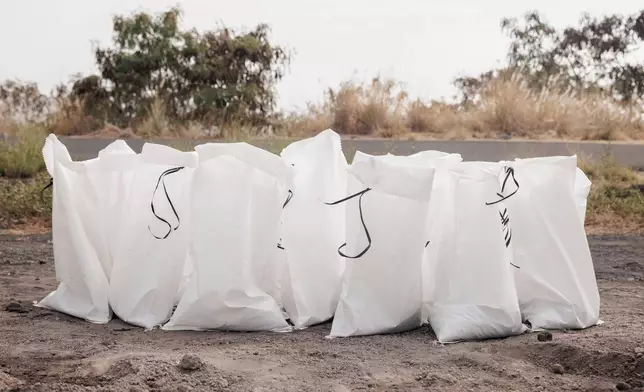 Sandbags are seen at a Hawaii County Department of Public Works sand pile ahead of Tropical Storm Lala in Kailua-Kona, Hawaii, Friday, Aug. 14, 2026. The tropical storm is forecast to strengthen into a hurricane as it approaches Hawaii, with up to 25 inches of rain possible on the island of Hawaii, also commonly known as the Big Island. (Stephen Lam/San Francisco Chronicle via AP)