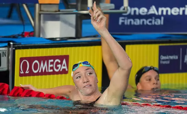 Lani Pallister, of Australia, celebrates after winning the women's 200-meter freestyle final at the Pan Pacific Swimming Championships in Irvine, Calif., Wednesday, Aug. 12, 2026. (AP Photo/Jae C. Hong)