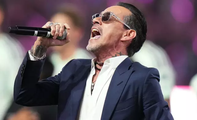 FILE - Marc Anthony performs the national anthem before an MLS soccer match between Inter Miami CF and Austin FC in Miami, April 4, 2026. (AP Photo/Lynne Sladky, File)