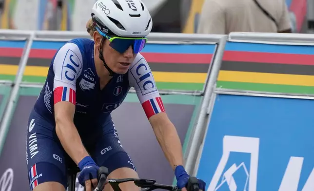 FILE - France's Pauline Ferrand-Prevot pedals during the women's Elite road race, at the road cycling World Championships in Kigali, Rwanda, on Sept. 27, 2025. (AP Photo/Jerome Delay)