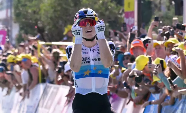 Netherlands' Demi Vollering celebrates as she crosses the finish line after winning the eighth stage of the Women's Tour de France cycling race (Tour de France Femmes) between Sisteron and Nice in Nice, France, Saturday, Aug. 8, 2026. (AP Photo/Philippe Magoni)