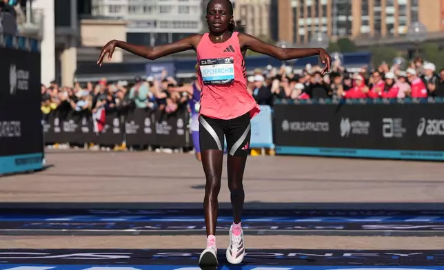 Peres Jepchirchir of Kenya reacts after crossing the finish line at the Opera House to win the women's Sydney Marathon, in Sydney, Sunday, Aug. 30, 2026. (AP Photo/Mark Baker)