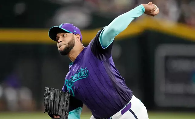 Arizona Diamondbacks starting pitcher Eduardo Rodriguez throws against the Cincinnati Reds during the first inning of a baseball game, Friday, Aug. 21, 2026, in Phoenix. (AP Photo/Ross D. Franklin)