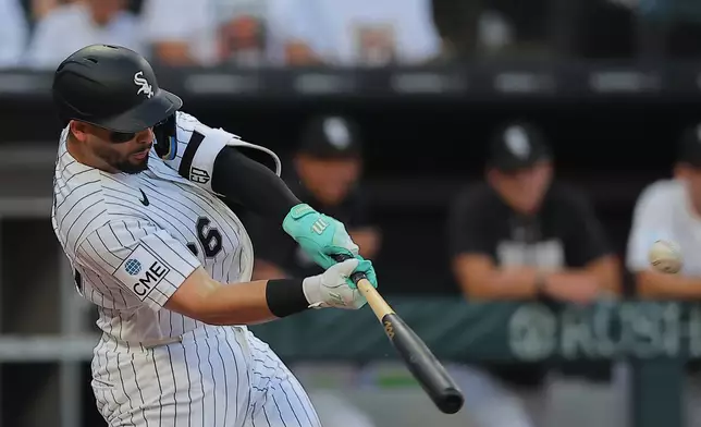 Chicago White Sox's Edgar Quero hits a home run during the second inning of a baseball game against the Cincinnati Reds, Tuesday, Aug. 11, 2026, in Chicago. (AP Photo/Melissa Tamez)