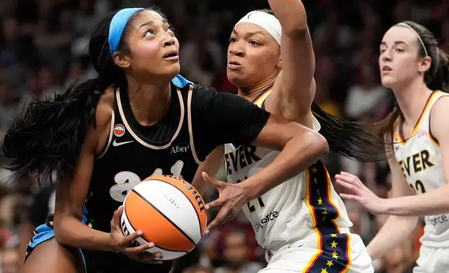Atlanta Dream forward Angel Reese (5) shoots the ball against Indiana Fever forward Makayla Timpson (21) in the first half of an WNBA basketball game Sunday, Aug. 16, 2026, in Atlanta. (AP Photo/Brynn Anderson)