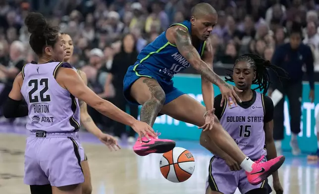 Minnesota Lynx guard Courtney Williams, middle, loses the ball between Golden State Valkyries guard Veronica Burton (22) and guard Tiffany Hayes (15) during the first half of a WNBA basketball game in San Francisco, Wednesday, Aug. 19, 2026. (AP Photo/Jeff Chiu)