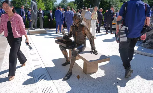FILE - A bronze depiction of Thomas Jefferson seated and signing the Declaration of Independence is seen before President Donald Trump speaks during an event to honor the 2025 World Series champions Los Angeles Dodgers in the Rose Garden of the White House, July 23, 2026, in Washington. (AP Photo/Julia Demaree Nikhinson, File)