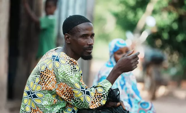 Sabi Bera Zakari, a farmer and father of stunted children, is photographed outside his house In N'dali, northern Benin, Sunday, May. 17, 2026. (AP Photo/Sunday Alamba)