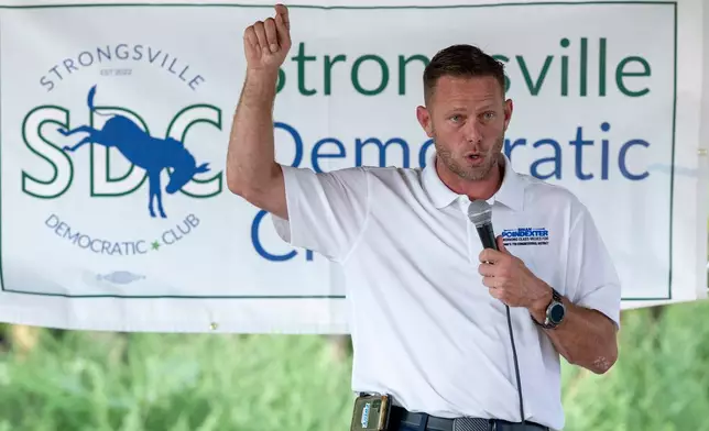 Brian Poindexter, Democratic nominee for Ohio's 7th congressional district, speaks at the Strongsville Democratic Club meeting, Wednesday, Aug. 5, 2026, in Strongsville, Ohio. (AP Photo/Nate Manley)