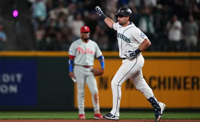 Seattle Mariners' Cal Raleigh jogs the bases after hitting a solo home run against the Philadelphia Phillies during the fifth inning of a baseball game, Monday, Aug. 24, 2026, in Seattle. (AP Photo/Lindsey Wasson)