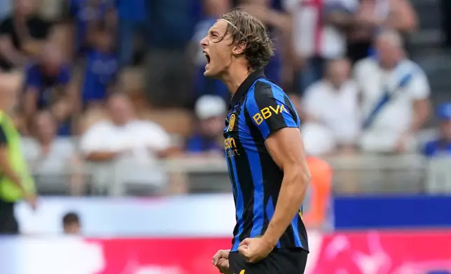 Inter Milan's Francesco Pio Esposito celebrates after scoring his side's third goal during a Serie A soccer match between Inter Milan and Monza, in Milan, Italy, Saturday, Aug. 22, 2026. (AP Photo/Luca Bruno)