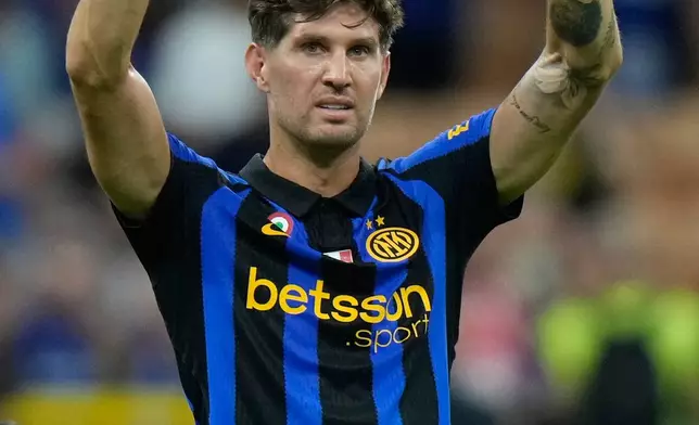 Inter Milan's John Stones waves to fans at the end of a Serie A soccer match between Inter Milan and Monza, in Milan, Italy, Saturday, Aug. 22, 2026. (AP Photo/Luca Bruno)