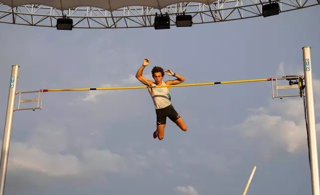 Armand Duplantis, of Sweden, competes in the men's pole vault competition at the Diamond League athletics city meet in Lausanne in Lausanne, Switzerland, Thursday, August 20, 2026. (Jean-Christophe Bott/Keystone via AP)