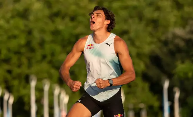 Armand Duplantis of Sweden celebrates during the men's pole vault competition at the World Athletics Diamond League Athletissima City event athletics meeting, in Lausanne, Switzerland, Thursday, Aug. 20, 2026. (Jean-Christophe Bott/Keystone via AP)