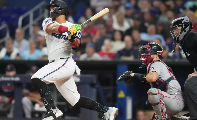 Miami Marlins' Heriberto Hernández hits a RBI single to score Kyle Stowers during the first inning of a baseball game, against the Boston Red Sox, Wednesday, Aug. 26, 2026, in Miami. (AP Photo/Lynne Sladky)
