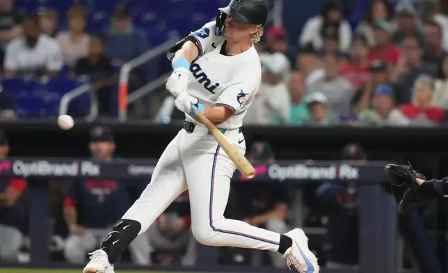 Miami Marlins' Kyle Stowers hits a single during the of a baseball game against the Boston Red Sox, Wednesday, Aug. 26, 2026, in Miami. (AP Photo/Lynne Sladky)