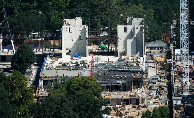 Workers continue construction on the new White House ballroom, as seen from the Washington Monument, Wednesday, Aug. 19, 2026, in Washington. (AP Photo/Alex Brandon)