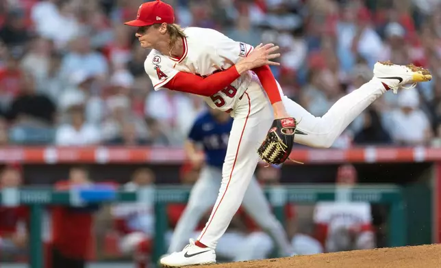 Los Angeles Angels starting pitcher George Klassen works against a Texas Rangers batter in the second inning of a baseball game Wednesday, Aug. 12, 2026, in Anaheim, Calif. (AP Photo/Karl Anderson)