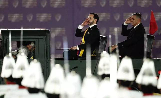 Colombia's President Abelardo de la Espriella reviews a military parade following his inauguration in Cali, Colombia, Friday, Aug. 7, 2026. (AP Photo/Ivan Valencia)
