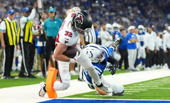 Atlanta Falcons running back Cash Jones (32) gets past Indianapolis Colts safety Daniel Scott (32) for a touchdown during the first half of an NFL football game in Indianapolis, Saturday, Aug. 22, 2026. (AP Photo/AJ Mast)