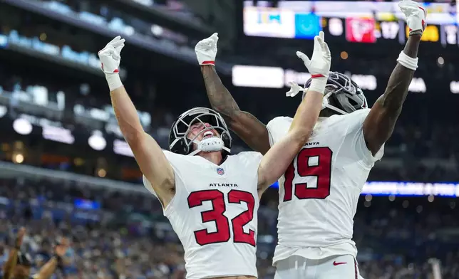 Atlanta Falcons running back Cash Jones (32) celebtes his touchdown with wide receiver Chris Blair (19) against the Indianapolis Colts during the first half of an NFL football game in Indianapolis, Saturday, Aug. 22, 2026. (AP Photo/AJ Mast)