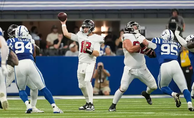 Atlanta Falcons quarterback Cooper Rush (13) throws against the Indianapolis Colts during the first half of an NFL football game in Indianapolis, Saturday, Aug. 22, 2026. (AP Photo/Nam Y. Huh)