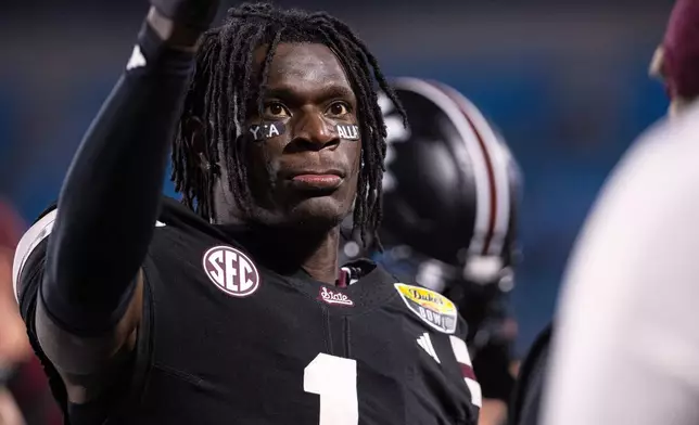 FILE - Mississippi State cornerback Kelley Jones (1) acknowledges the fans before the Duke's Mayo Bowl NCAA college football game against Wake Forest, Jan. 2, 2026, in Charlotte, N.C. (AP Photo/Scott Kinser, File)