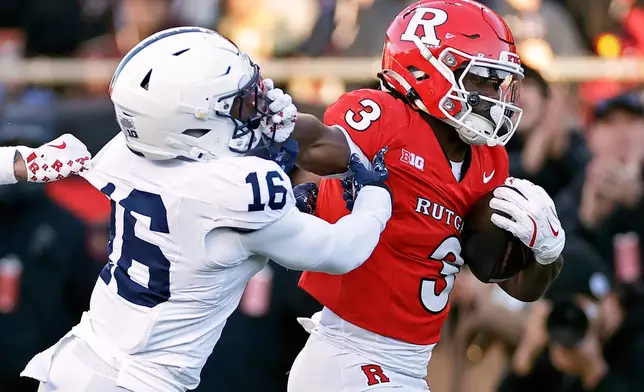 FILE - Rutgers running back Antwan Raymond (3) runs for a touchdown past Penn State safety King Mack (16) during the first half of an NCAA college football game, Nov. 29, 2025, in Piscataway, N.J. (AP Photo/Adam Hunger, File)