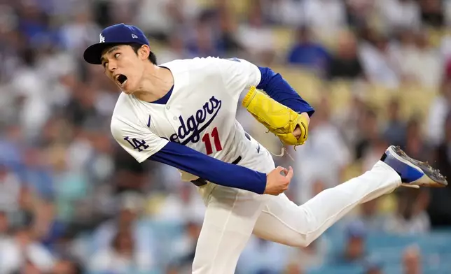 Los Angeles Dodgers starting pitcher Roki Sasaki throws to the plate during the first inning of a baseball game against the Milwaukee Brewers, Thursday, Aug. 13, 2026, in Los Angeles. (AP Photo/Mark J. Terrill)