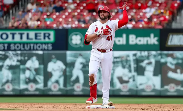 St. Louis Cardinals' Alec Burleson gestures toward the dugout after hitting a two-RBI double during the fifth inning of a baseball game against the Philadelphia Phillies Wednesday, Aug. 12, 2026, in St. Louis. (AP Photo/Scott Kane)