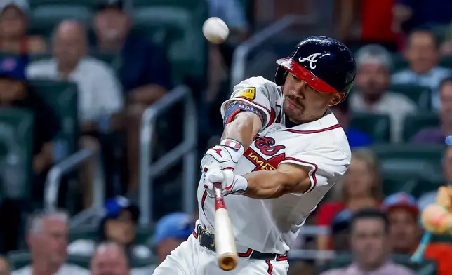 Atlanta Braves designated hitter Drake Baldwin hits a two-run double against the Los Angeles Dodgers during the fourth inning of a baseball game, Wednesday, Aug. 26, 2026, in Atlanta. (AP Photo/Erik S. Lesser)