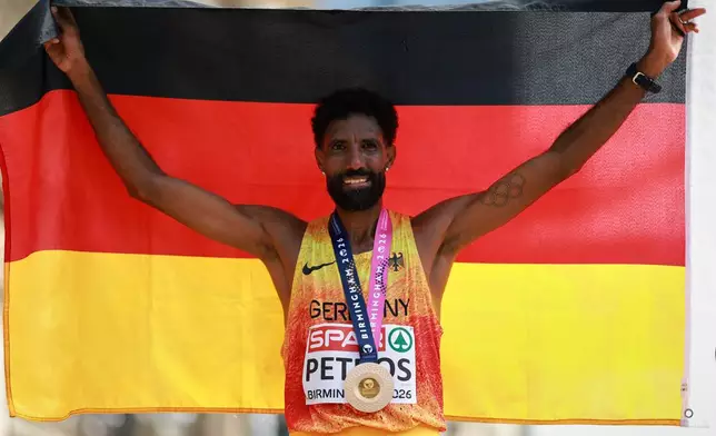 Amanal Petros of Germany celebrates winning the men's marathon at the European Athletics Championships in Birmingham, England, Sunday, Aug. 16, 2026. (AP Photo/Morgan Harlow)