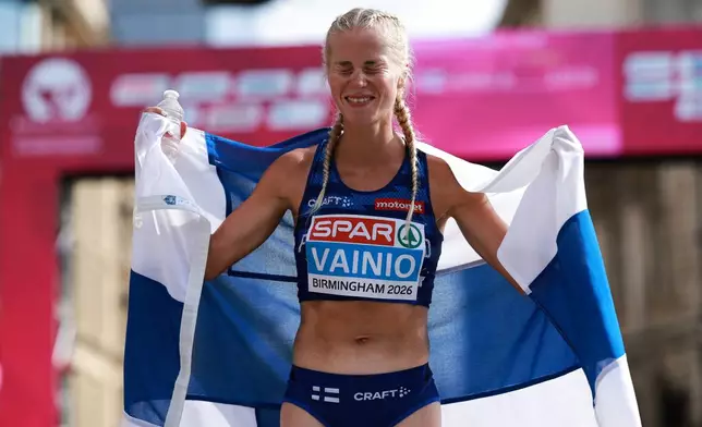 Alisa Vainio of Finland reacts after winning the women's marathon at the European Athletics Championships in Birmingham, England, Sunday, Aug. 16, 2026. (AP Photo/Morgan Harlow)