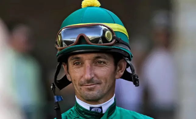 FILE - Jockey Robby Albarado looks on before a horse race at Keeneland Race Course in Lexington, Ky., Oct. 16, 2010. (AP Photo/Garry Jones, File)