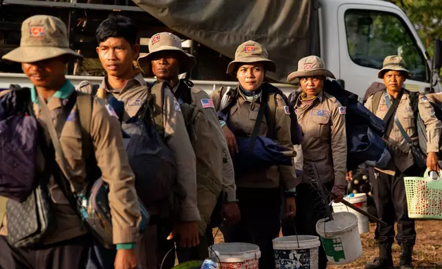 Deminers prepare to enter a landmine field in Siem Reap, Cambodia on Thursday, July 2, 2026. (AP Photo/Anton L. Delgado)