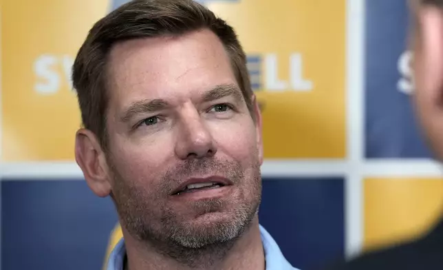 FYI - Rep. Eric Swalwell, D-Calif., talks with reporters after holding a town hall meeting in Sacramento, Calif., April 7, 2026. (AP Photo/Rich Pedroncelli, File)