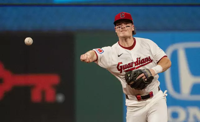 Cleveland Guardians' Travis Bazzana throws San Diego Padres' Xander Bogaerts out at first base during the eighth inning of a baseball game, Saturday, Aug. 15, 2026, in Cleveland. (AP Photo/Phil Long)